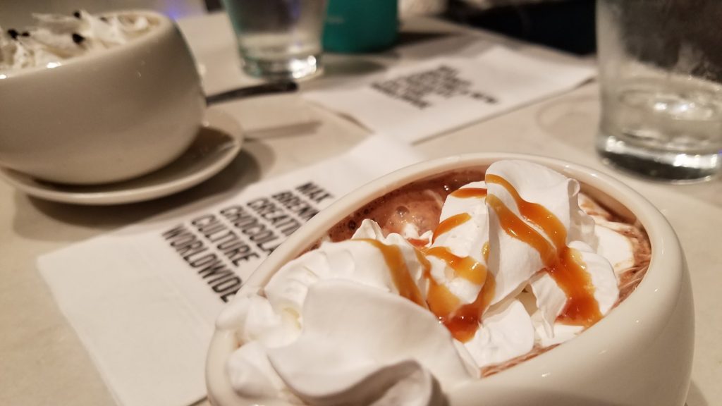 A delicious ice cream desert topped with caramel sauce