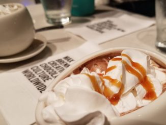 A delicious ice cream desert topped with caramel sauce