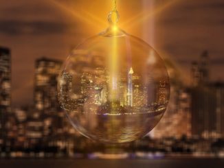 New York's skyline inside a Christmas decoration with a yellow light shining through