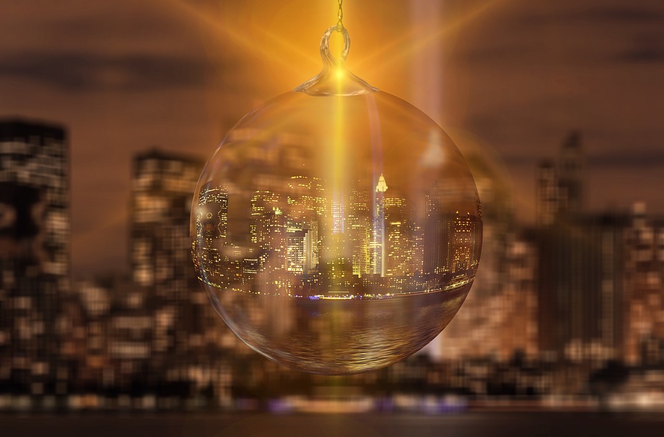 New York's skyline inside a Christmas decoration with a yellow light shining through