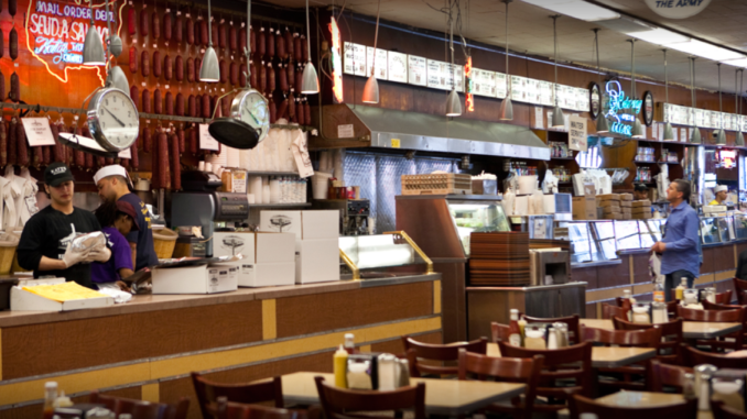 customer waits as food is prepared at Katz's Deli New York