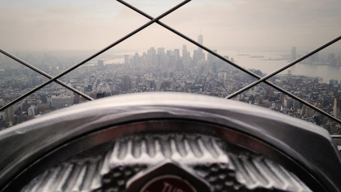 Telescope pointed at the Empire State Building from the Rockefeller Center