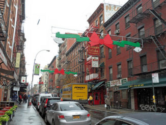 Street view in little italy new york with street decorations above the road