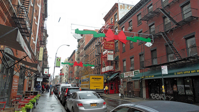 Street view in little italy new york with street decorations above the road