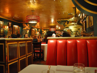 Red leather seats, gold ceiling and green walls decorate the Russian Tea Room NYC