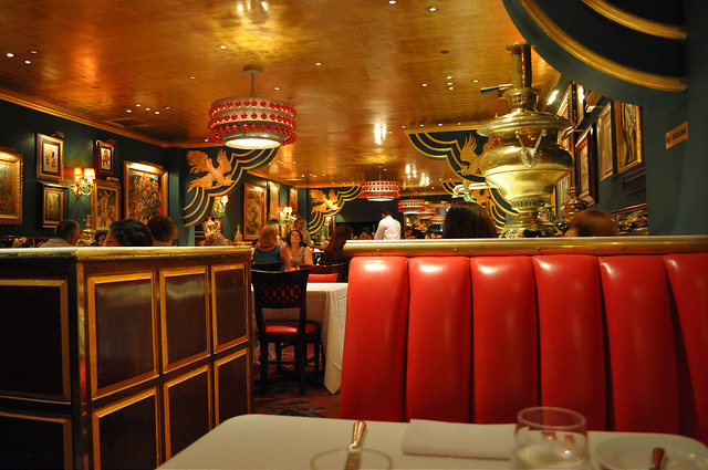 Red leather seats, gold ceiling and green walls decorate the Russian Tea Room NYC