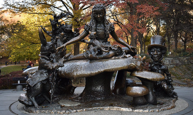 The Alice in Wonderland Bronze Statue in front of trees Central Park