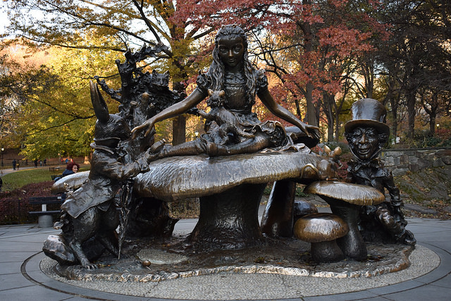 The Alice in Wonderland Bronze Statue in front of trees Central Park