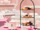 Cakes and tea sit on a table at a Eloise-Themed Afternoon Tea at The Plaza Hotel New York