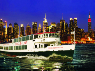 Circle Line Ship sails up the Hudson River with New York skyline in background