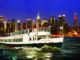 Circle Line Ship sails up the Hudson River with New York skyline in background