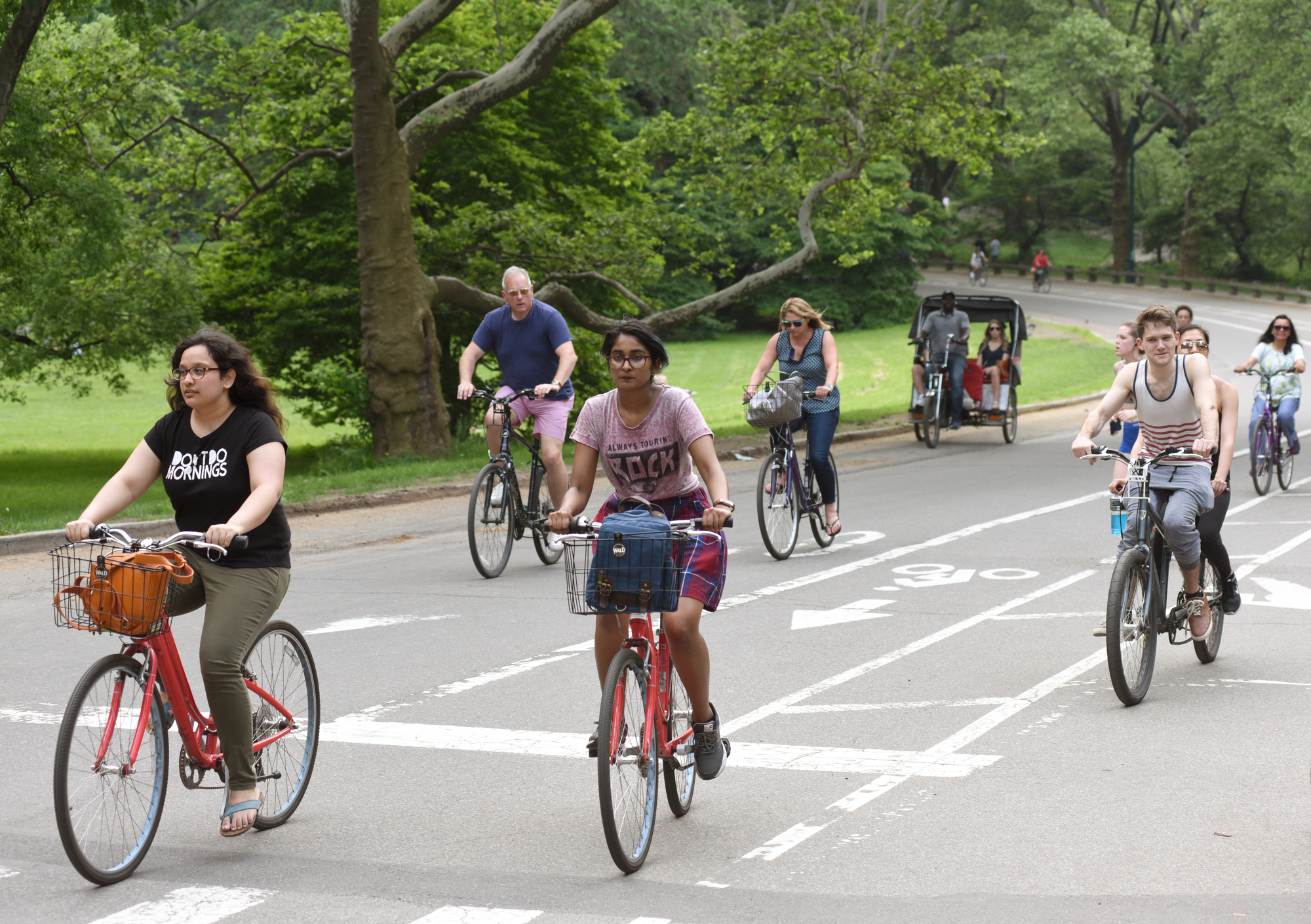 an image of people riding bicycles on one of the new york sightseeing tours