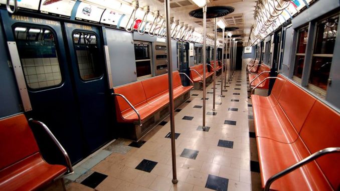 A vintage car on display at New York Transit Museum that visitors are able to board.