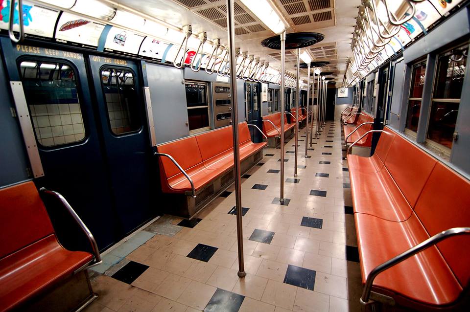A vintage car on display at New York Transit Museum that visitors are able to board.