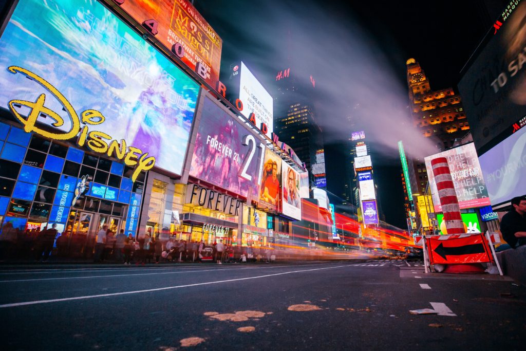 People enjoy New York City’s Times Square at night