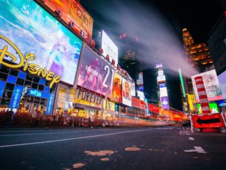 People enjoy New York City’s Times Square at night