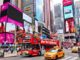 Gray Line Sightseeing Bus in New York takes passengers through Times Square