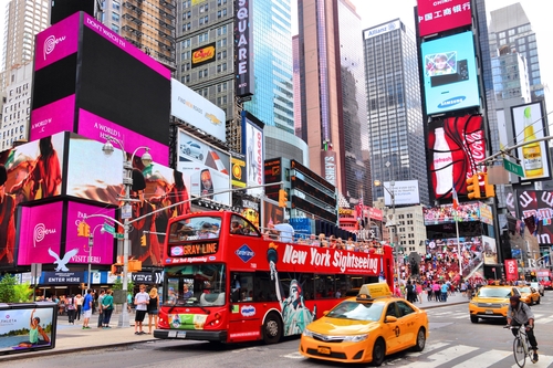 Gray Line Sightseeing Bus in New York takes passengers through Times Square