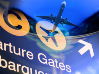 Airport sign with an airplane taking off