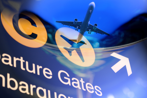 Airport sign with an airplane taking off