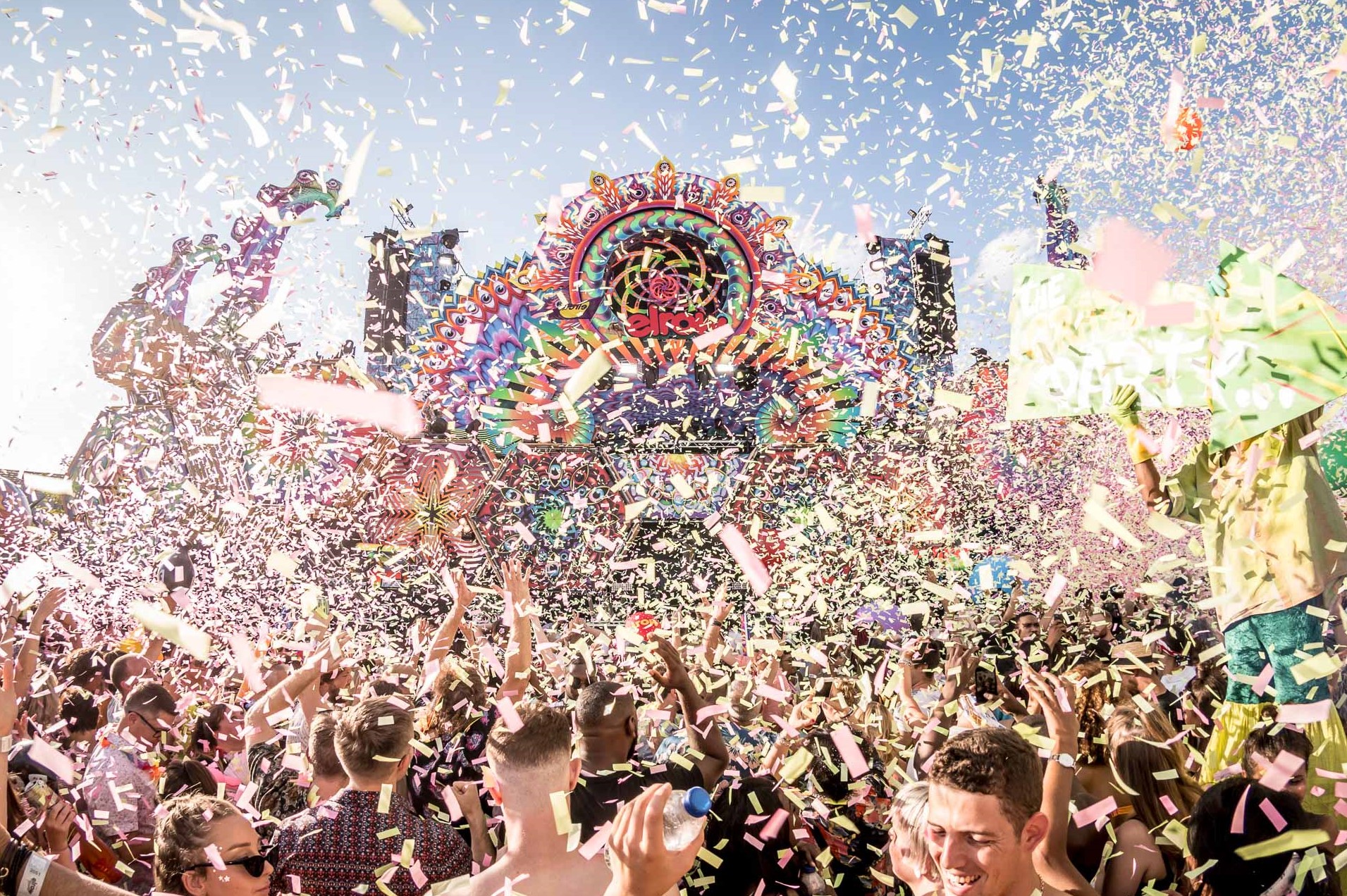 Crowd at Elrow dance underneath confetti in front of main stage - new york in december