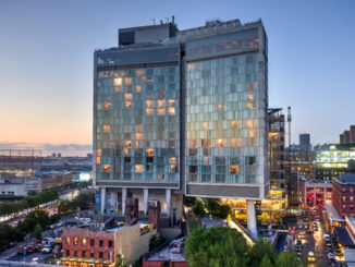 View across Manhattan Meatpacking District and Chelsea from above, at sunset with The Standard Hotel in view.