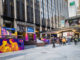 people walk by Outside madison square garden new york