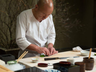 chef at the Masa Restaurant prepares food for diners