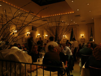 diners sit and chat while waiting for their food Inside Babbo Restaurant New York