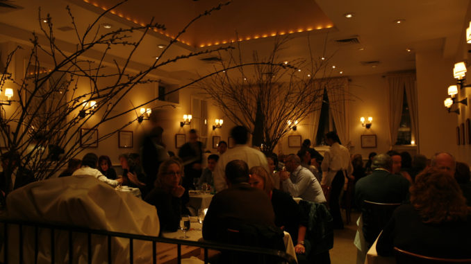 diners sit and chat while waiting for their food Inside Babbo Restaurant New York