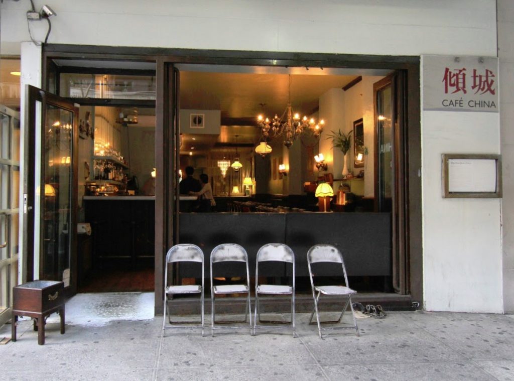 four empty chairs sit outside the Café China, Manhattan