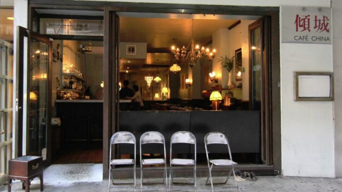 four empty chairs sit outside the Café China, Manhattan