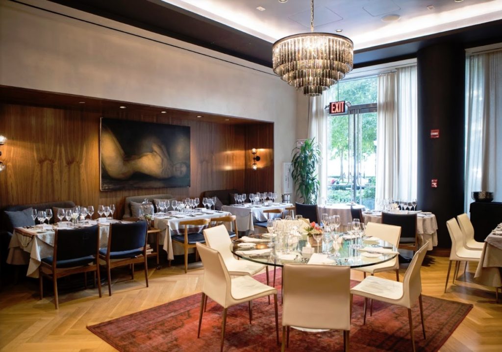 empty tabls await their guests inside L’Appart Restaurant New York