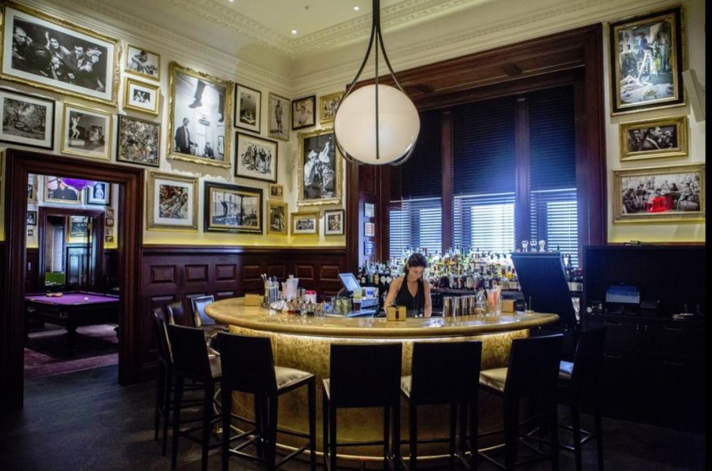 bar tender ready to prepare drinks for punters Inside the Clocktower New York City