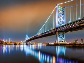 Ben Franklin Bridge and Philadelphia skyline by night as viewed from Camden across the Delaware river