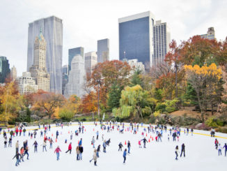 New York City ice-skaters having fun in Central Park - Cheapest time to travel to New York City