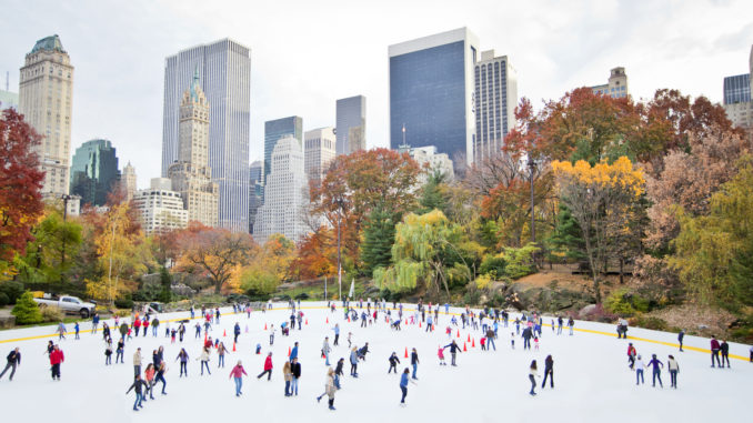 New York City ice-skaters having fun in Central Park - Cheapest time to travel to New York City