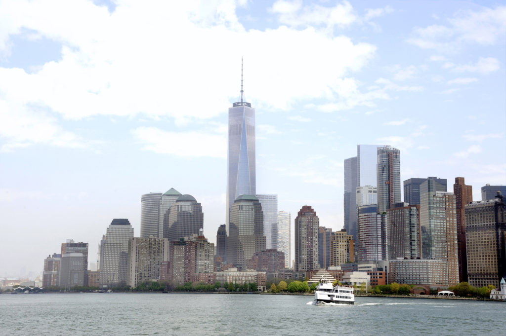 The Manhattan skyline overlooking a cruise ship on the Hudson River - Circle Line Sightseeing Cruises