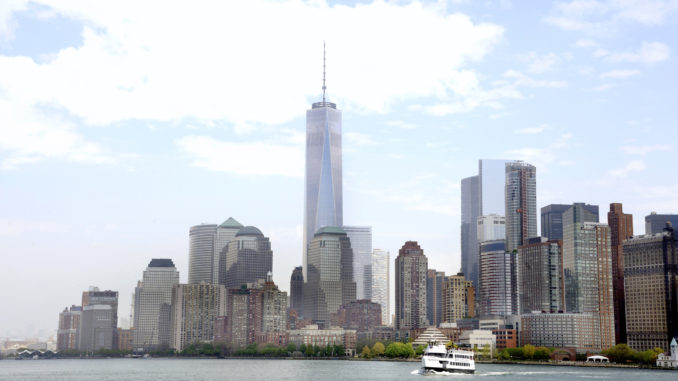 The Manhattan skyline overlooking a cruise ship on the Hudson River - Circle Line Sightseeing Cruises