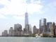 The Manhattan skyline overlooking a cruise ship on the Hudson River - Circle Line Sightseeing Cruises