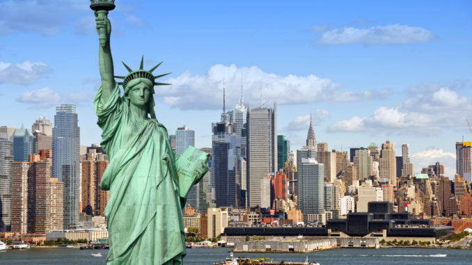 A cityscape view of New York's attractions including the Statue of Liberty