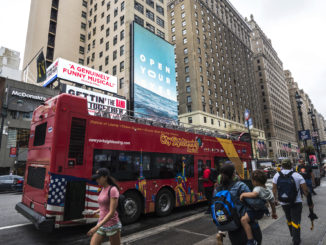 Tour bus takes sightseers round the city for New York tours