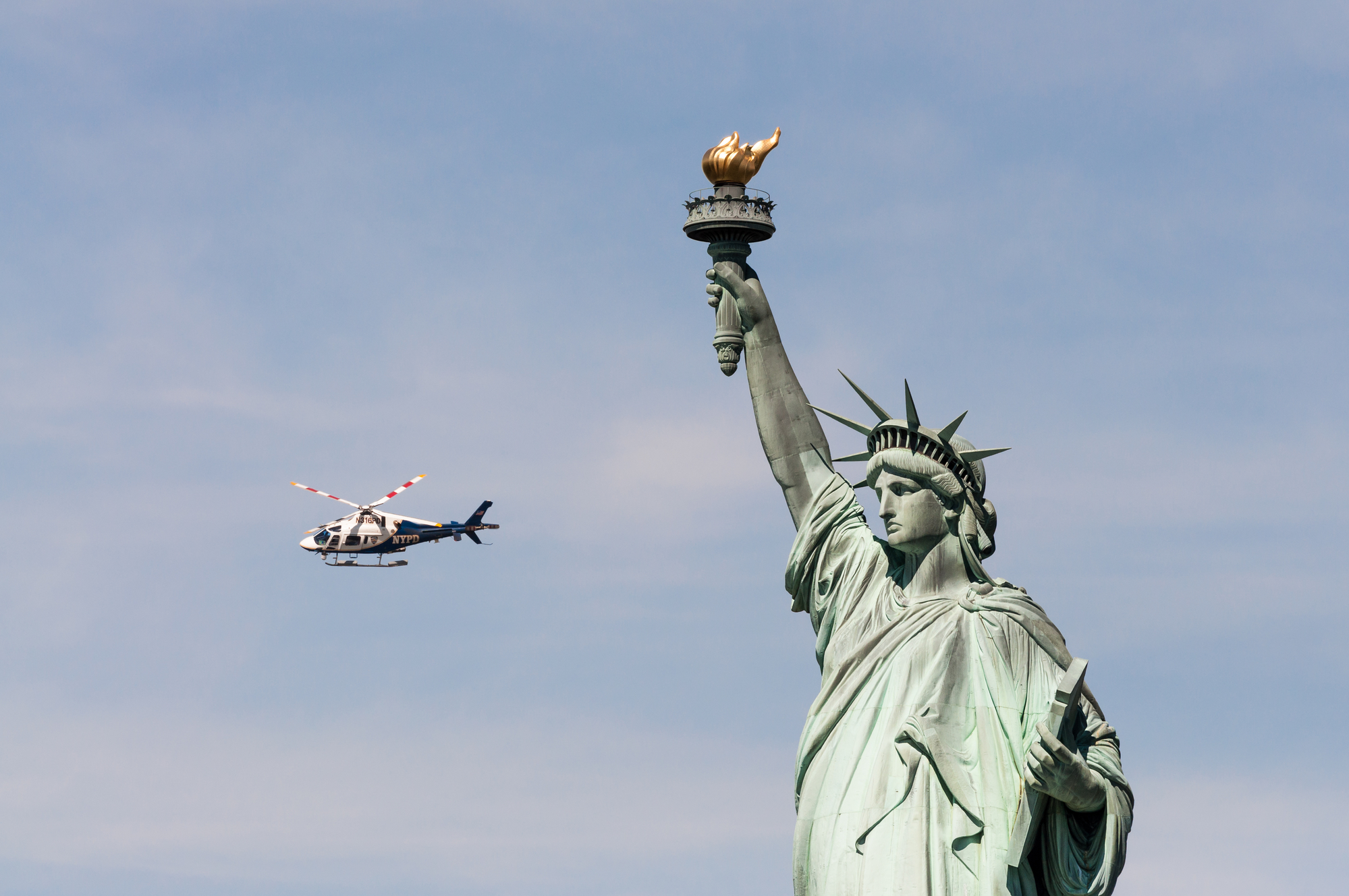 pic-of-helicopter-flying-past-statue-of-liberty-how-much-spending-money-new-york