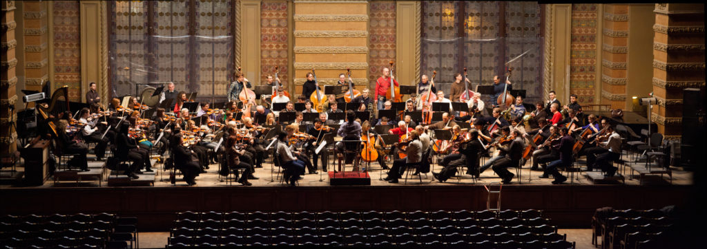 picture of a philharmonic band practicing new york in june