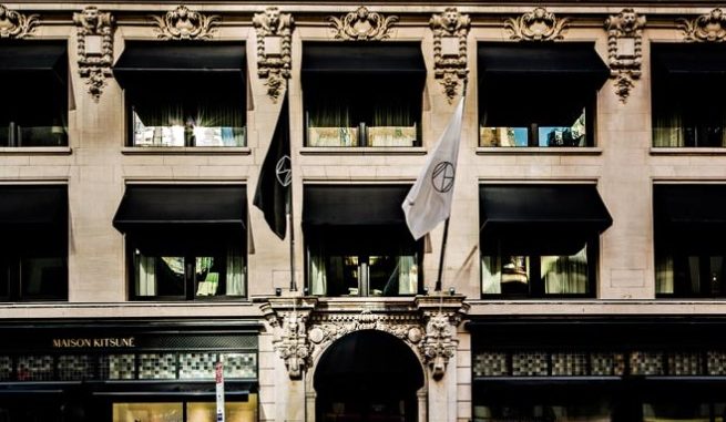 Front of the NoMah Hotel New York with flags blowing in the wind