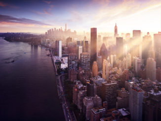 view over new york city with sun rising over skyscrapers