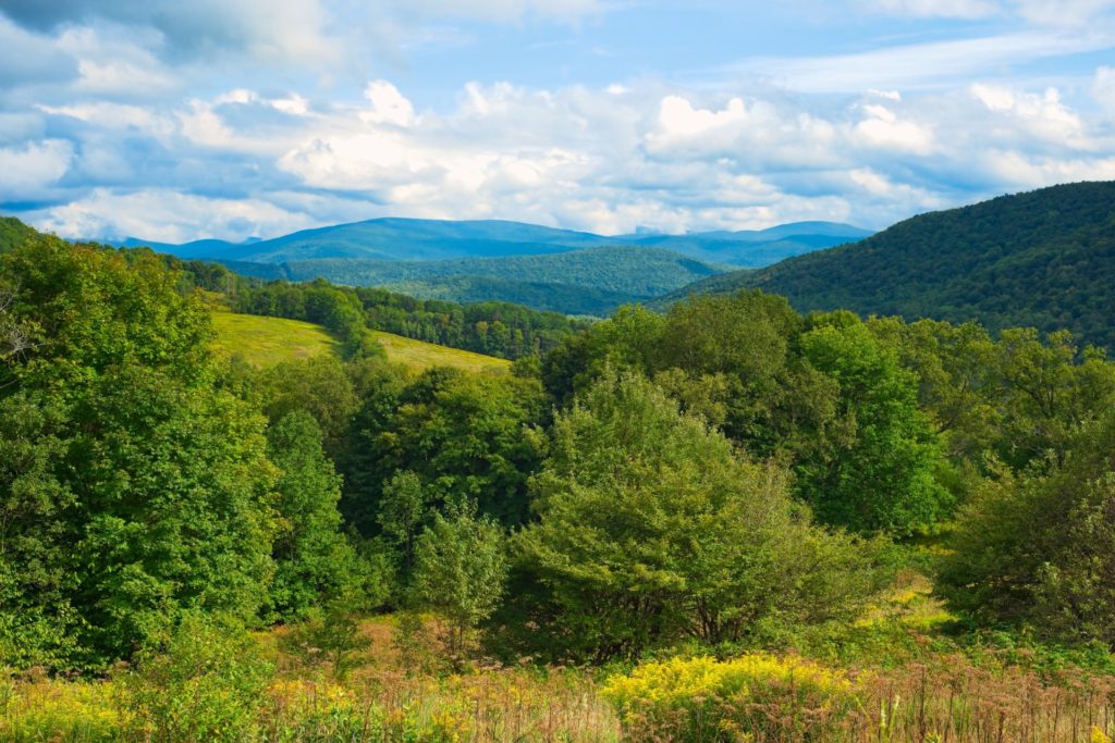 lovely view of the mountains over the hills at the catskill national park - national parks in new york